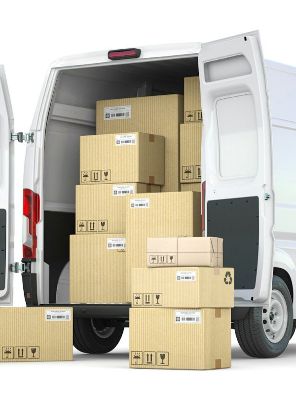 Delivery van with open doors and hand truck with cardboard boxes isolated on white background